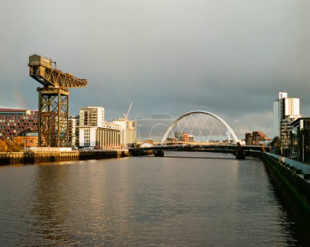 Photo for Shipbuilding crane at Finnieston next to the Clyde Arc and Bells Bridge in Glasgow UK - Royalty Free Image