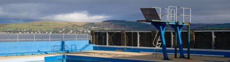 Photo for Outdoor open air swimming pool closing for maintenance in Gourock UK - Royalty Free Image
