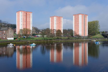 Photo for High rise orange council flats in Dumbarton next to River Leven UK - Royalty Free Image