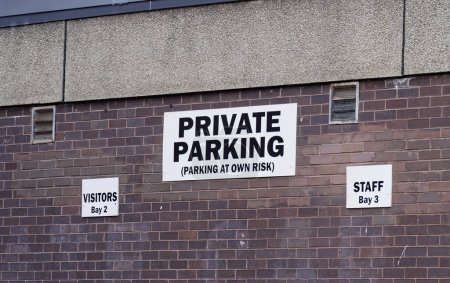 Photo for Private parking sign warning park at own risk UK - Royalty Free Image