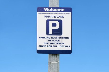 Photo for Private parking sign on land with parking restrictions UK - Royalty Free Image