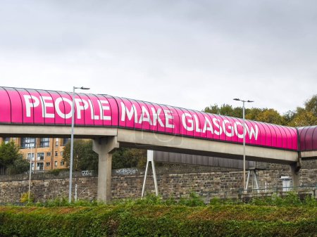 Photo for People Make Glasgow slogan banner sign on city tunnel walkway - Royalty Free Image