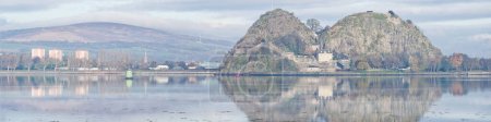 Photo for Dumbarton castle on volcanic rock overlooking the River Clyde with Ben Lomond in the background UK - Royalty Free Image