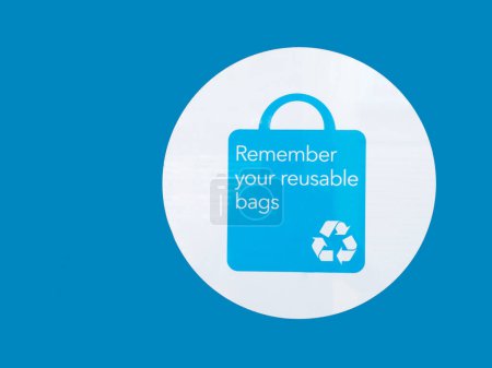 Remember your reusable bag sign on wall close up UK
