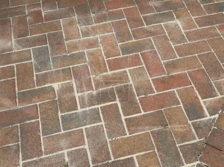 Monoblock paving blocks on patio with sand between joints UK