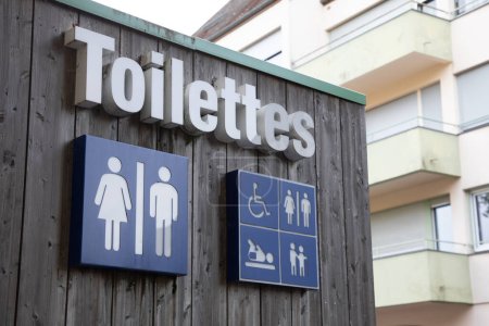 Photo for Toilettes french text means wc Toilet sign icon on wooden building facade water-closets wall entrance - Royalty Free Image