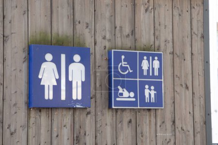 Photo for Wc Toilet sign men women  icon on wooden building facade water closets wall entrance - Royalty Free Image