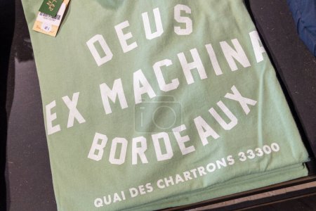 Photo for Bordeaux , Aquitaine France - 12 12 2022 : Deus ex machina bordeaux logo brand and sign text on shirt fashion clothes motorcycle surf coffee concept store - Royalty Free Image