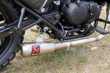 Photo for Bordeaux , Aquitaine  France - 11 12 2022 : Akrapovic Exhaust Systems brand logo and text sign on royal enfield muffler on custom motorcycle - Royalty Free Image