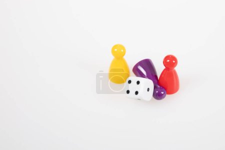 Photo for Board game concept colorful pawns with a six sided dice - Royalty Free Image
