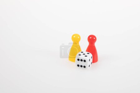 Photo for Pawns board game pieces and six sided dice on white background - Royalty Free Image