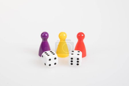 Photo for Board pieces colorful game pawns with a six sided dice - Royalty Free Image