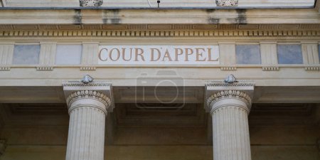 Foto de Cour d'appel text on ancient wall facade building means in french appeal court courtroom - Imagen libre de derechos