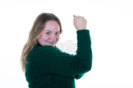Téléchargez les photos : Overweight blonde woman smile happy satisfied flexing muscular biceps arm in white background - en image libre de droit
