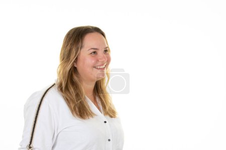 Téléchargez les photos : Overweight woman smiling happy profile side view in friendly attitude look side copy space in white background - en image libre de droit
