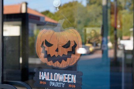 Photo for Halloween Party text sign on door shop with scary faced pumpkins orange in holiday design banner - Royalty Free Image
