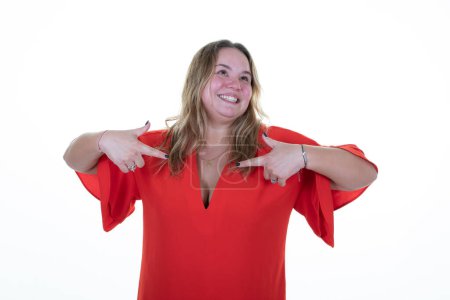 Téléchargez les photos : Overweight woman curvy portrait blonde self proud positive and casual pointing to red chest with finger hands - en image libre de droit