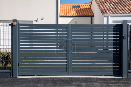 modern grey gate aluminum portal with blades gray design of suburban house