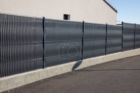 Photo for Wall fence street aluminium modern barrier around the house protect view home garden - Royalty Free Image