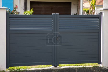 Photo for Door grey double steel gate aluminum portal of home suburbs house in city - Royalty Free Image