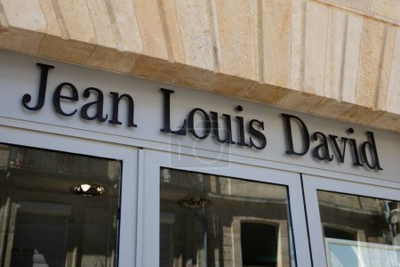 Foto de Burdeos, Aquitania Francia - 04 17 2023: Jean Louis David sign text and brand logo france of hairdresser salon facade barber shop - Imagen libre de derechos