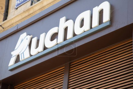 Photo for Bordeaux ,  Aquitaine France - 04 17 2023 : Auchan logo brand and text sign brown city entrance wall facade of French group of supermarket - Royalty Free Image