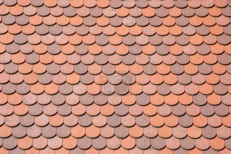 Photo for Red tile roof clay tiles roof of a private house made of shingles - Royalty Free Image