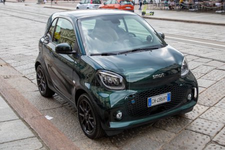 Photo for Milan , Italy  - 07 10 2023 : smart eq fortwo car small dark little parked in street - Royalty Free Image