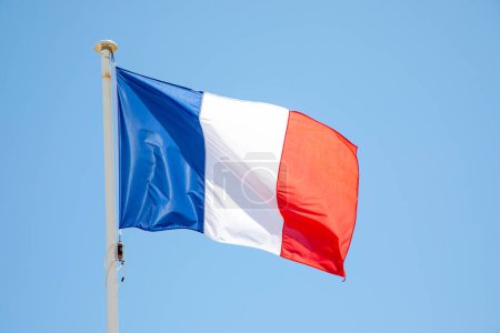 Photo for French tricolors blue white red flag patriot france fabric on mat blue sky waving - Royalty Free Image