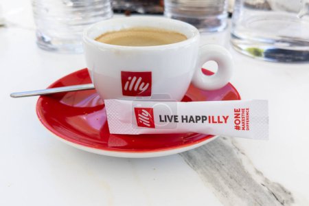 Photo for Bordeaux , France -  08 18 2023 : Illy coffee shop red sign logo cafe Italian coffee makers text brand on cup with white sugar bag - Royalty Free Image