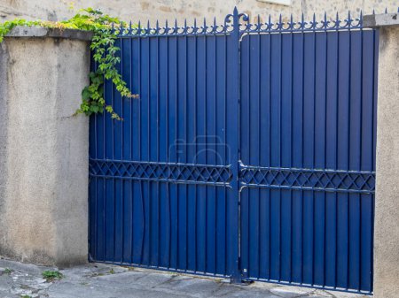 Photo for Blue portal steel gate house portal of old traditional european classic house - Royalty Free Image