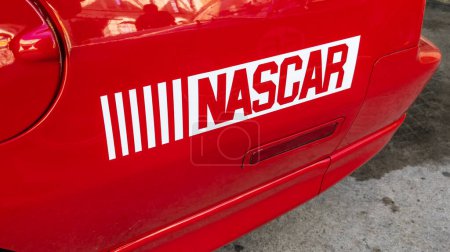 Photo for Daytona Beach, USA - 09 06 2023 : nascar logo brand and text sign on side racing sport car in circuit for supercar race - Royalty Free Image