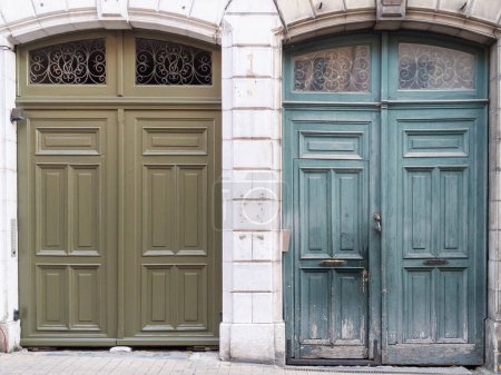 Photo for Restored wooden door facade before and after painting and repair by professional garage gate entrances portal - Royalty Free Image