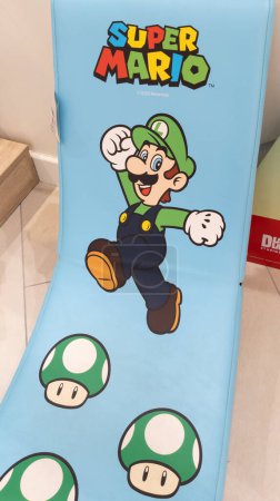 Photo for Bordeaux , France - 10 02 2023 : Supermario Bros character Super Mario Luigi figurine on fabric relax beach chair - Royalty Free Image
