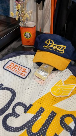 Photo for Bordeaux , France - 10 06 2023 : Deus motorcycles cap and breitling shirt in store with logo brand fashion shop and text sign in motorcycle boutique - Royalty Free Image