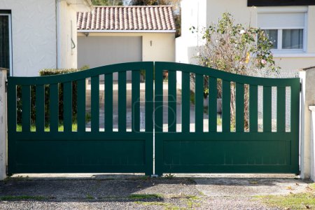 Photo for Portal double street suburb home steel green metal retro house gate garden access door - Royalty Free Image