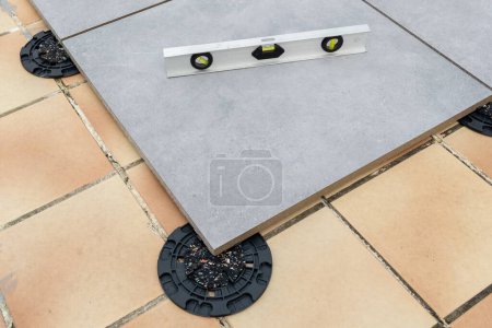 tiles grey with Outdoor Pedestal with spirit level for Rubber Shim supports with adjustable level stud slope corrector plastic pad