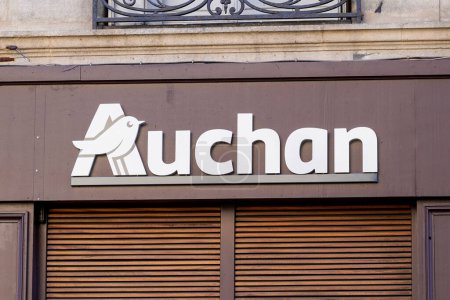 Photo for Bordeaux , France -  01 06 2024 : Auchan supermarche logo brand and text sign facade wall entrance brown city facade of French group of supermarket - Royalty Free Image