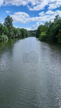 Photo for River Clain in Poitiers French city crossing green forest long river in western France - Royalty Free Image
