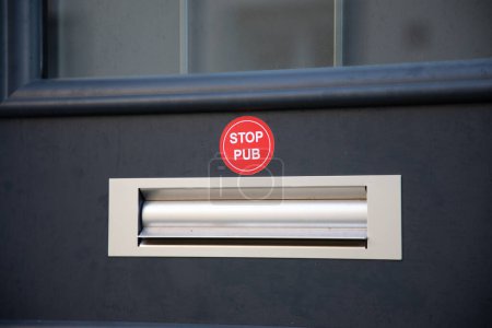 Photo for Mailbox with text sticker label written in French stop pub in concept of unsolicited advertising and invasive flyers in France - Royalty Free Image