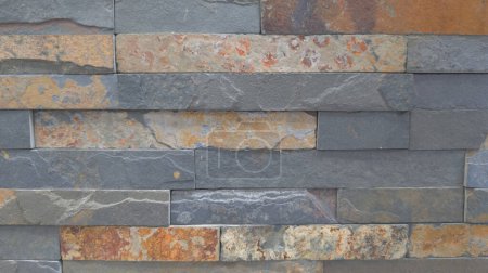 facade stone brown gray wall background of brick horizontal stones grey wallpaper