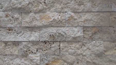 Gestapelte Steinziegel dunkelgraue Wand Hintergrund Fassade horizontal