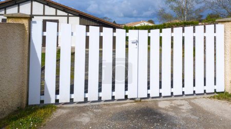 white gate pvc plastic classic portal with panel blades in city suburbs house street