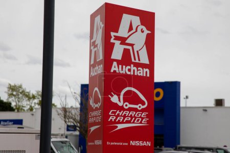 Photo for Bordeaux , France -  03 28 2024 : Auchan born electric logo brand of French retailer sign text on charging point ev by nissan - Royalty Free Image