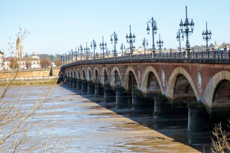Pont de Pierre bridge over the Garonne river in Bordeaux city ancient stone bridge in Nouvelle Aquitane french Gironde