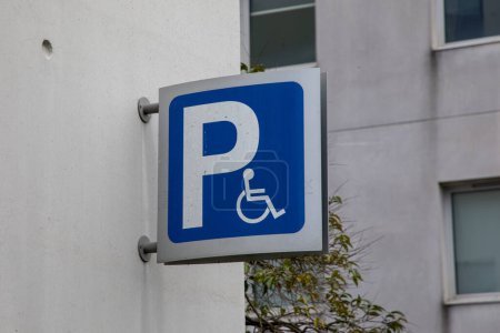 Photo for Wheelchair car parking traffic signal on the street for handicap disabled area for vehicle reserved - Royalty Free Image