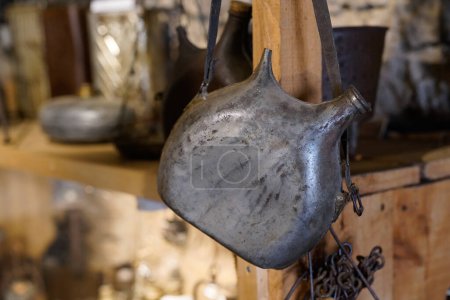 Old vintage metal flask ancient in farm museum Hures la Parade
