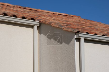 Photo for Corner home new modern house with roof and gutter white cream modern facade - Royalty Free Image