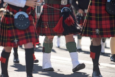 Photo for Kilts and spats are worn in honor of the Irish tradition during the St Patricks Day parade. - Royalty Free Image