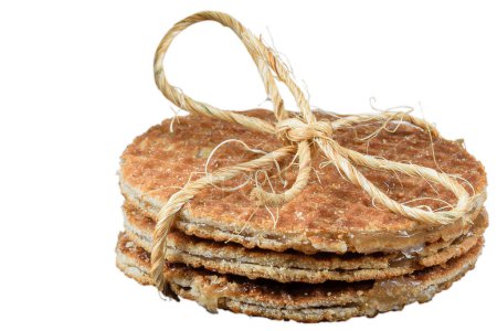 Photo for Closeup of several stroopwafels cookies with a sisal bow_white background. - Royalty Free Image
